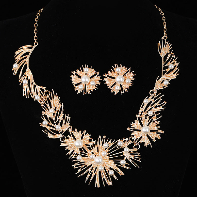 Elegant pearl sunburst necklace set with matching earrings