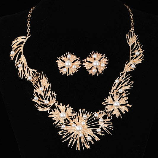 Elegant pearl sunburst necklace set with matching earrings