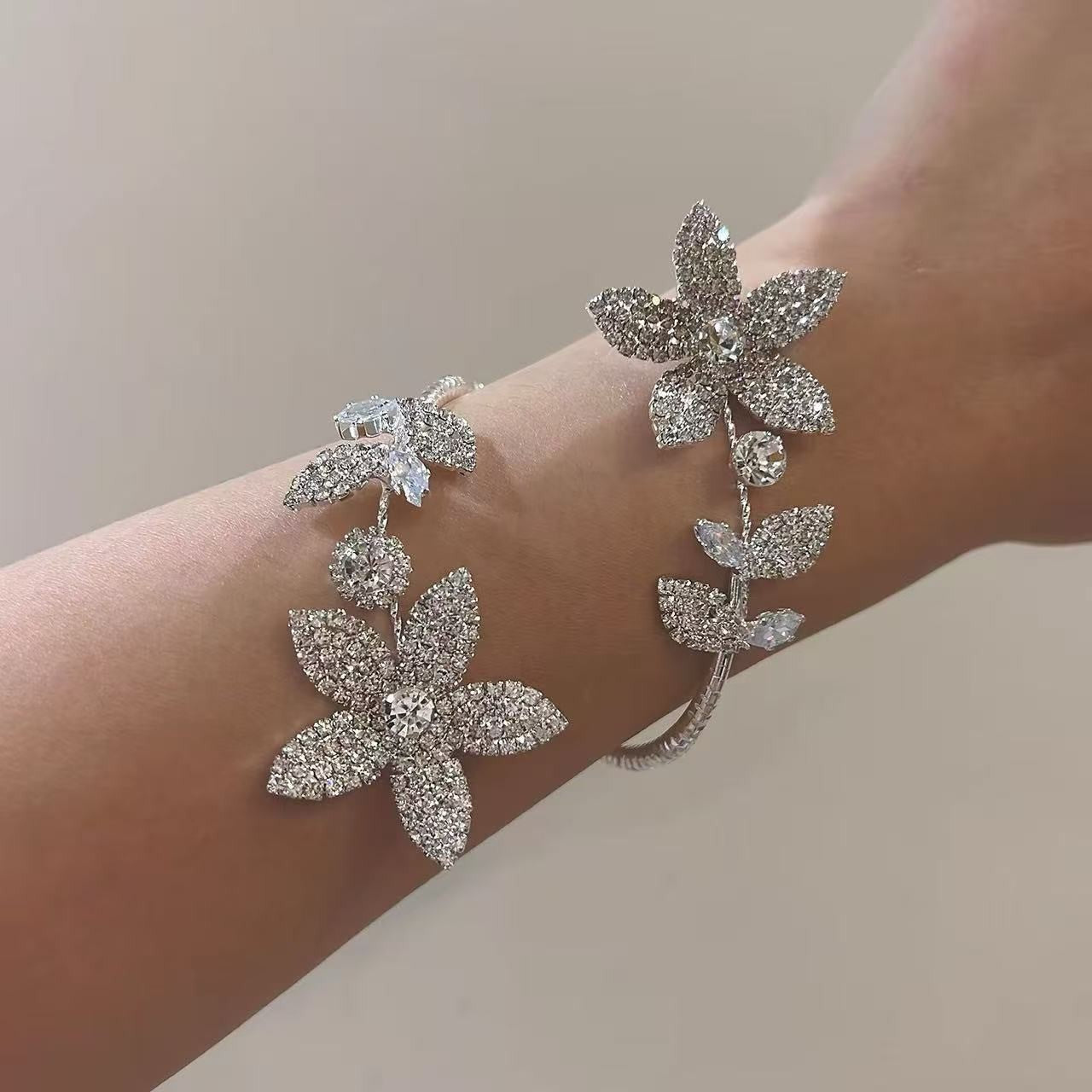 Stylish silver crystal flower bangle for women, close-up showing sparkling petals and adjustable open design, perfect gift or fashion accessory
