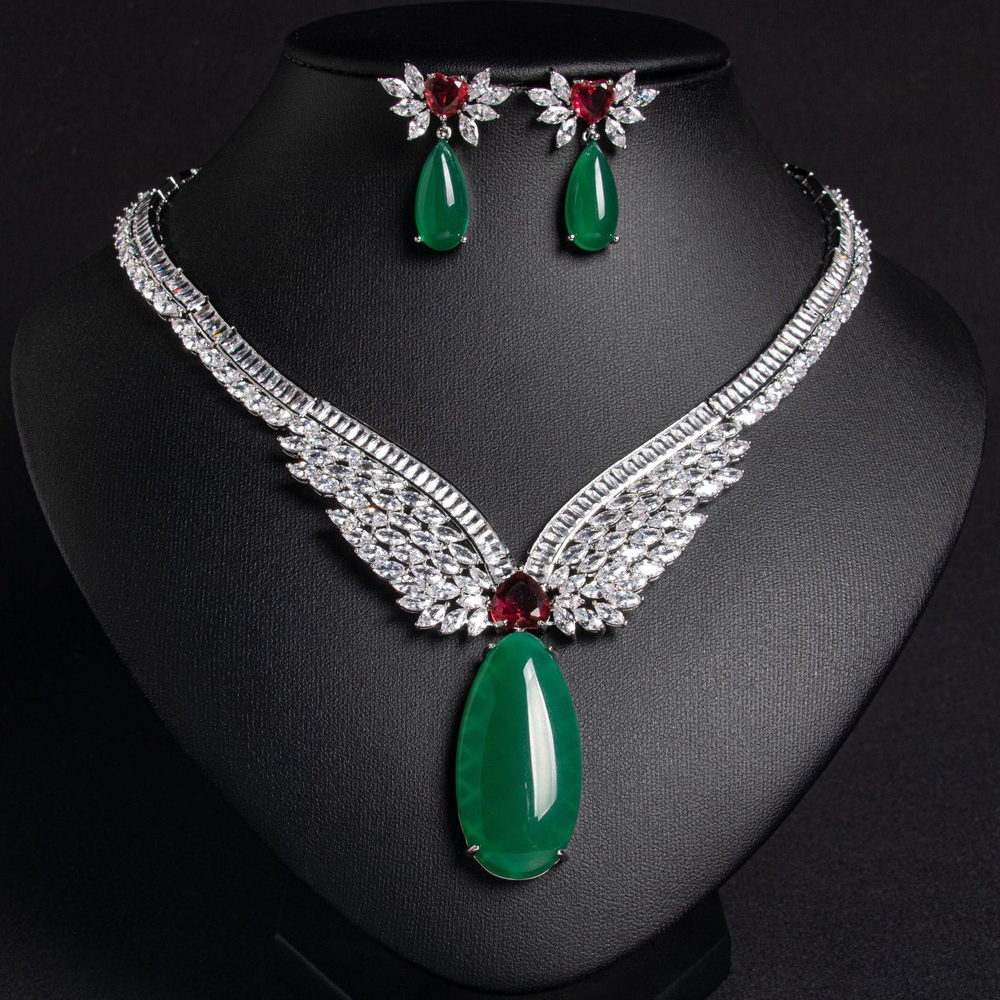 Sparkling rhinestone wing necklace with jade green pendant